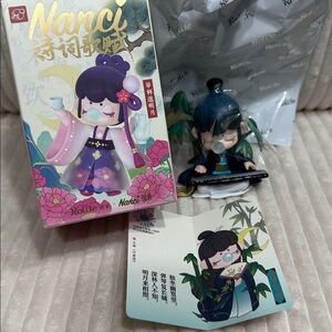 PLAYING GUZHENG…”
- Nanci Chinese Poetry Series figurine. New. Opened to verify.